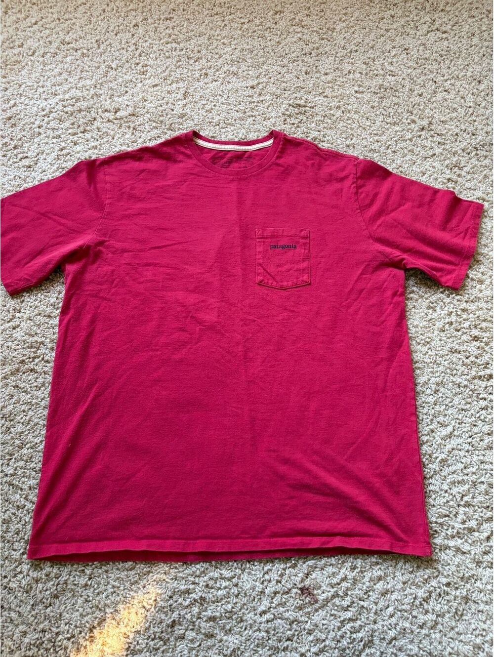 Patagonia red t-shirt with a chest pocket and a branded logo tag XL